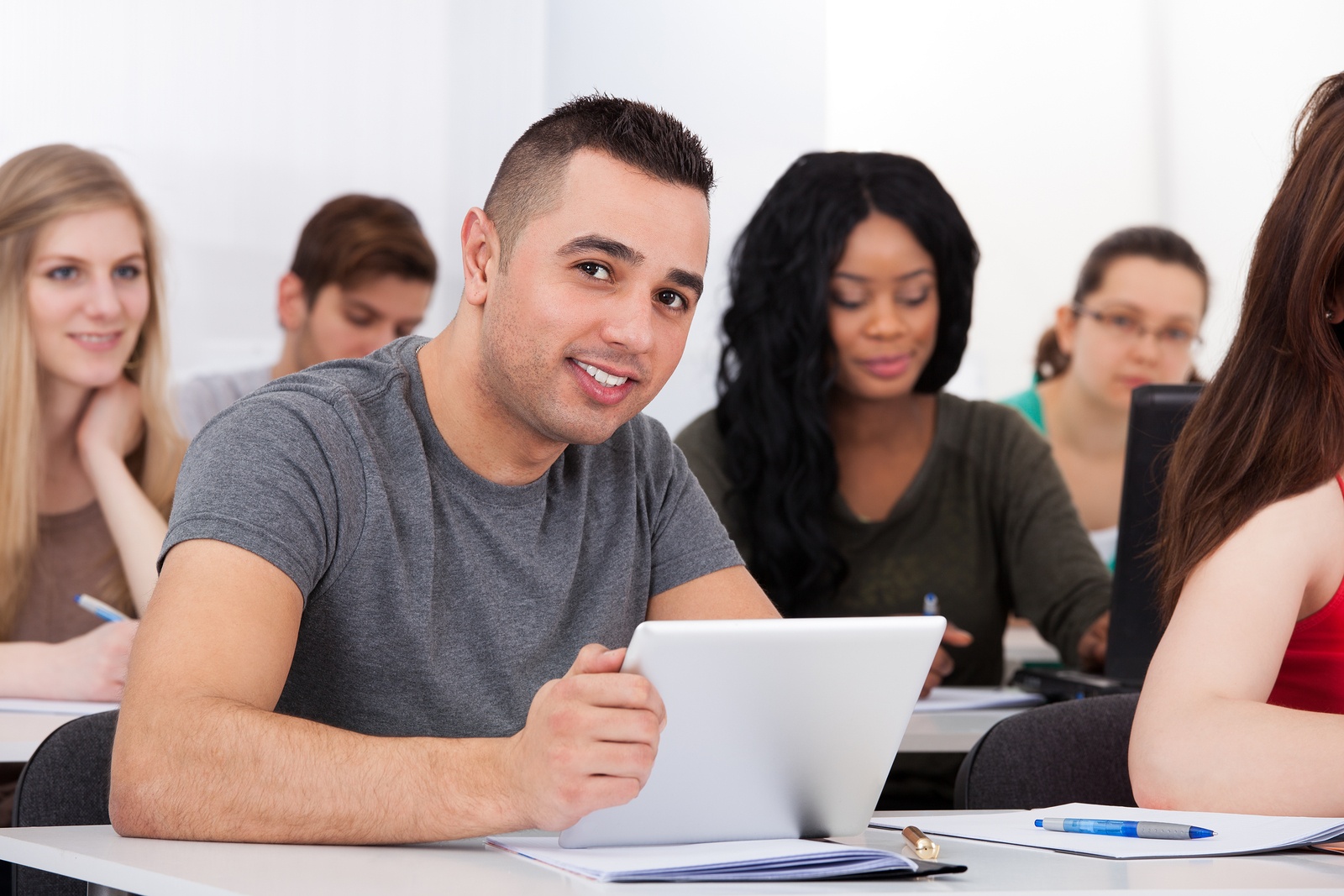 bigstock-Confident-Male-Student-Holding-72293533