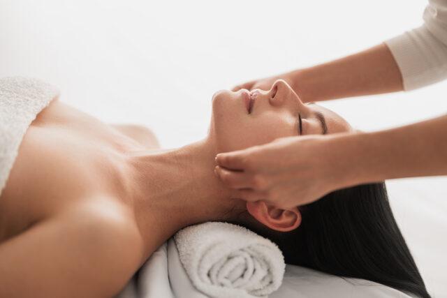 Woman receiving neck massage